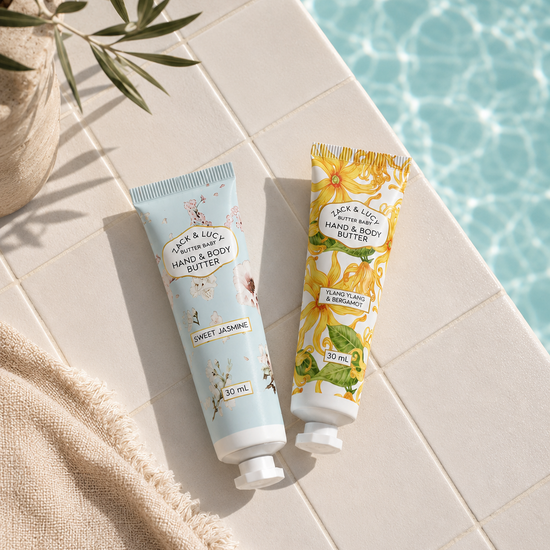 2 body butter tubes next to a pool