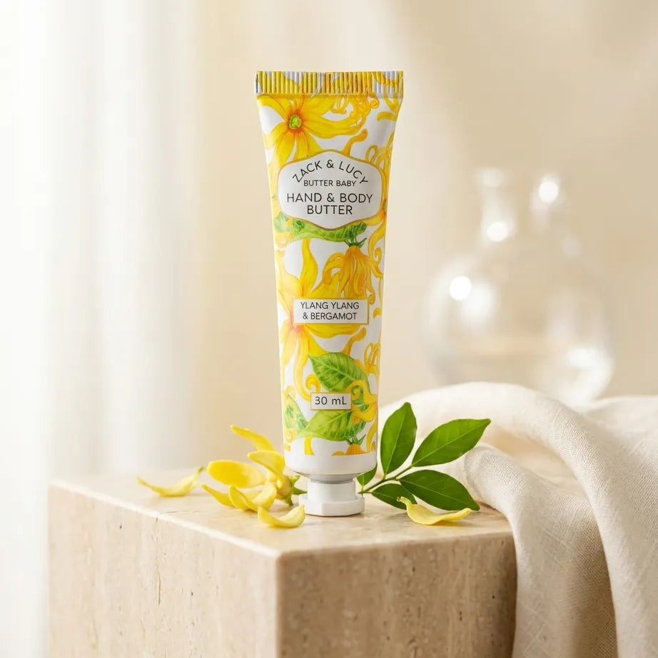 Hand and body butter tube with lemon design on a light background